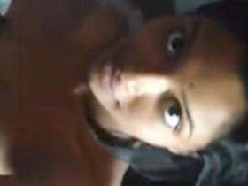 A rural woman displays her breasts, vagina, and buttocks