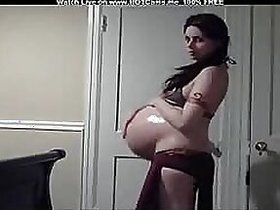 Pregnant Arab lady outside the whole camera