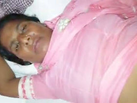 An Indian aunt masturbates while with a customer