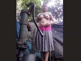 Attractive wife takes outdoor bath, displaying her body and self-pleasureing