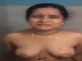 Desi bhabhi from South India undresses and washes herself