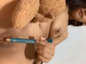 Adorable girl pleasuring herself with her fingers