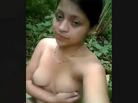 Young Asian girl pleasuring herself outdoors