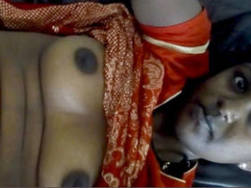 Indian beauty flaunts her large breasts and intimate parts in a live performance