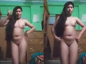 Stunning young woman performs sensual dance while unclothed to Dilbar music