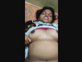 A bald Indian woman's vagina is vigorously penetrated by a man from the same ethnic background