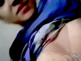 A Pakistani woman displays her large breasts confidently