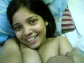 Indian woman undressed on the bed by her boyfriend caught on camera
