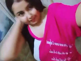 A highly aroused girl displays her breasts in a bathroom