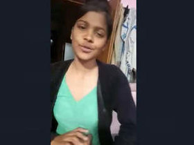 A seductive Indian woman removes her clothing and exposes her nude physique to her partner for financial gain