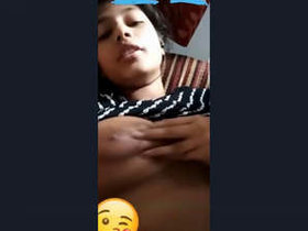 An Indian beauty reveals her ample bosom in a passionate recording