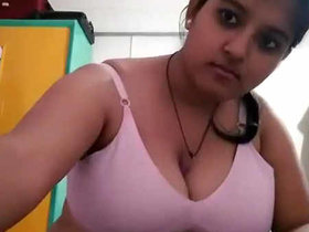 Ankita, a Bengali girl, indulges in self-pleasure and sucks her ample bosom in a video