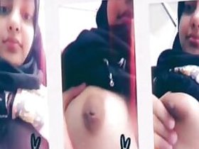 Pretty angel in hijabi shows her big tits on webcam