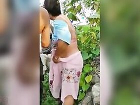 Assamese Desi wife with her husband in the open air MMS