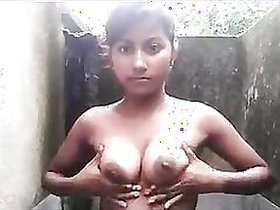 Stripped Indian adult teenager likes to show off her melons in outdoor movie selfies in the bathroom