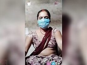 Desi XXX face masked wife shows her tits and pussy on live camera
