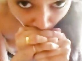 Scene from an Indian sex film about a pretty girl giving oral services to a guy