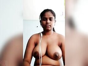 Chubby girl poses for a video call to show her XXX boobs to the guy