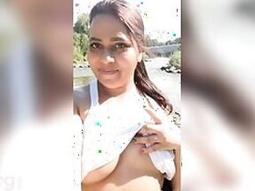 Horny slut pulls on a white top to flaunt her boobs in XXX form for Desi Boys