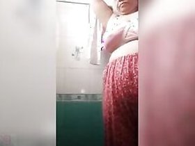 Fat Desi the slut filmed herself performing a XXX striptease in the bathroom.