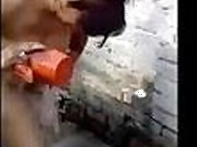 Video of a rustic aunt taking a bath outdoors, filmed by her lusty boyfriend for your enjoyment!